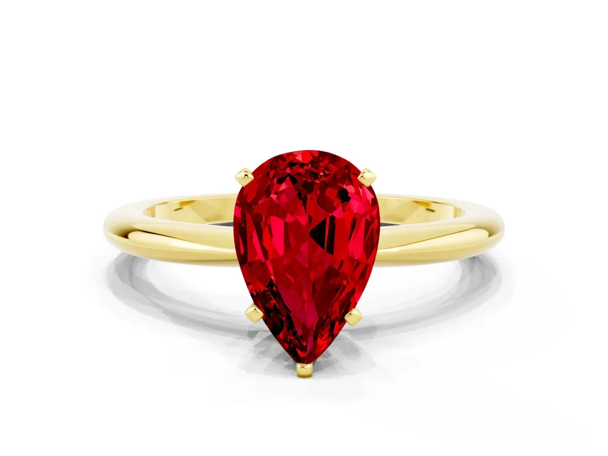 Pear Cut Ruby Solitaire Ring with Six-Prong Setting and Classic Band Yellow gold