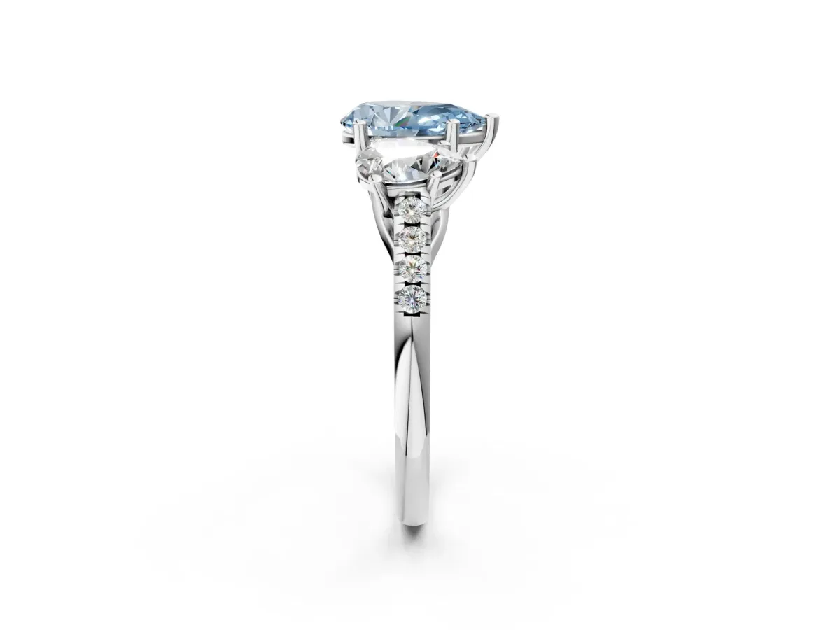Fancy Blue Three-Stone Pear Cut Diamond Ring with Round Pavé Band and Prong Setting Platinum