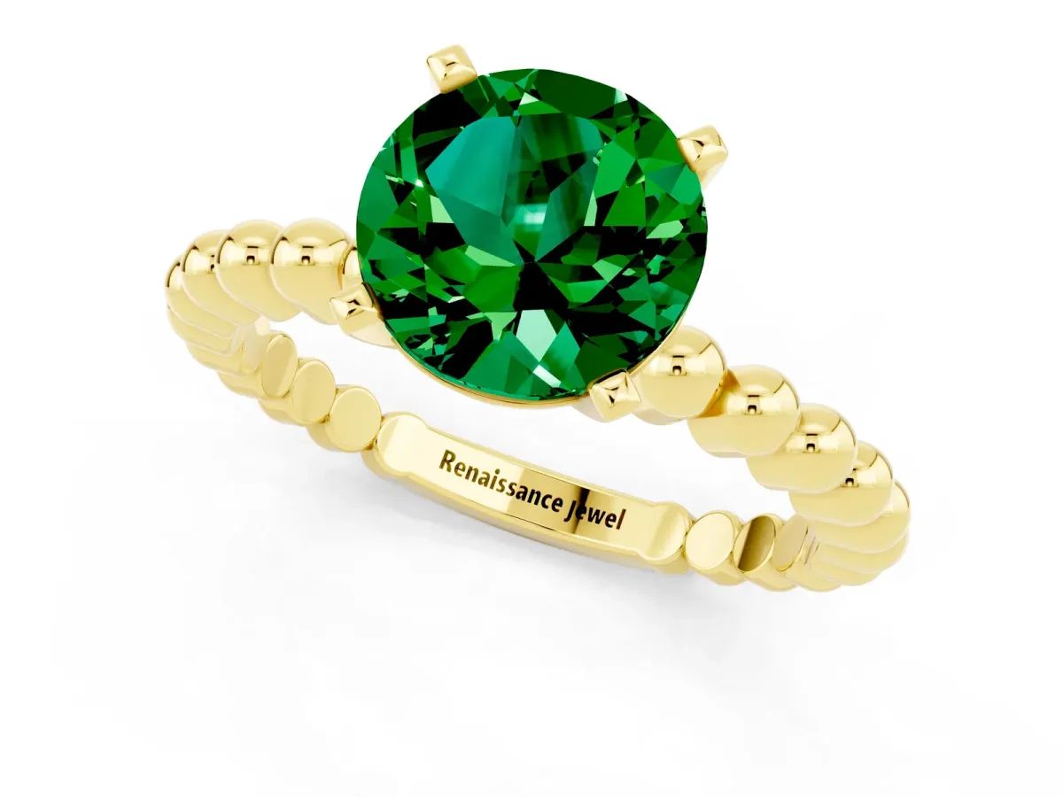 Round Cut Emerald Solitaire Ring with Beaded Band and Prong Setting Yellow gold
