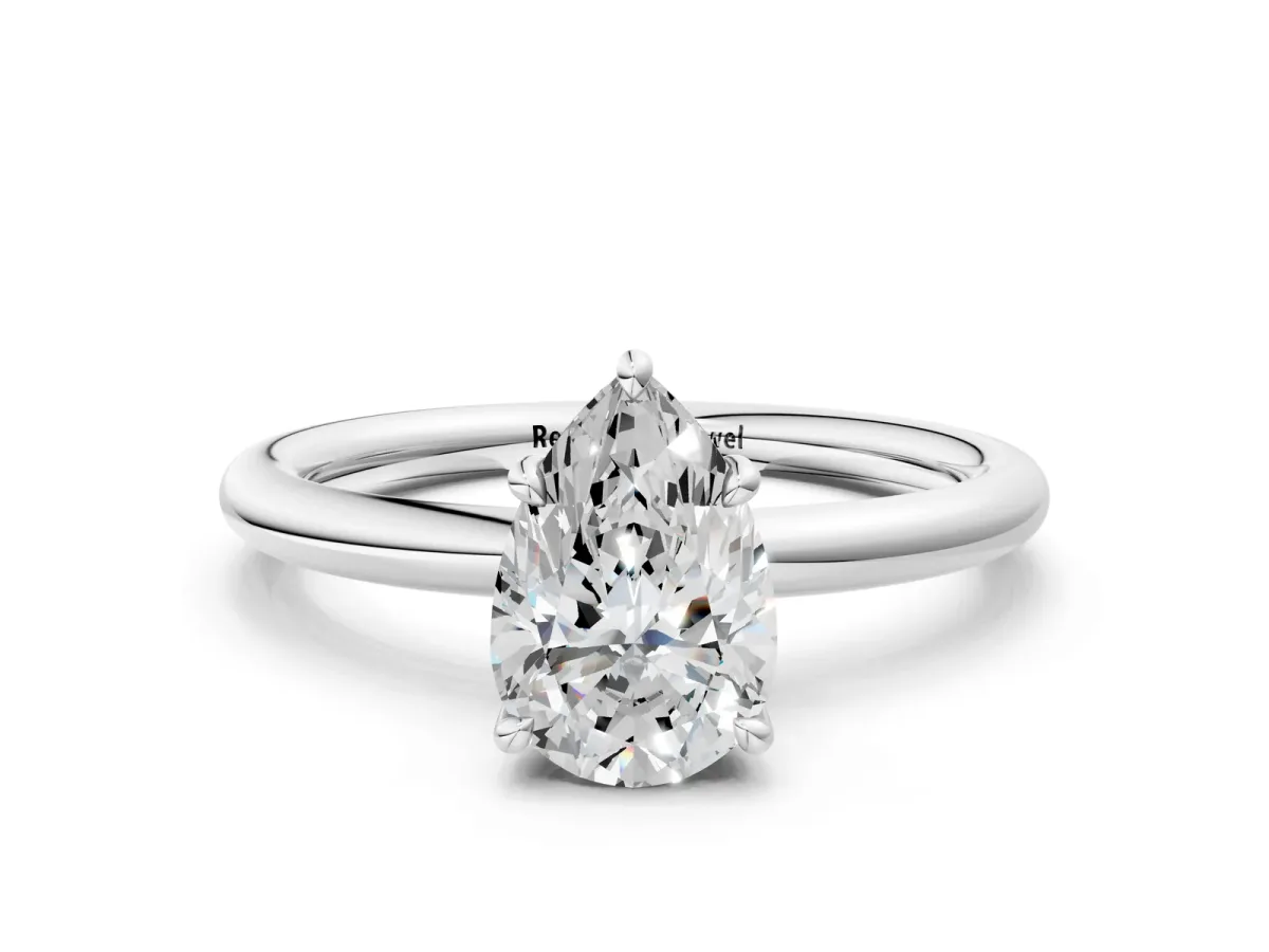 Pear Cut Diamond Solitaire Ring with Thin Band and Four-Prong Setting Silver