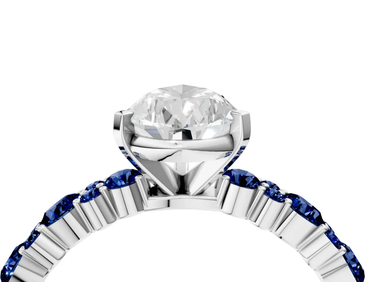 Pear Cut Diamond Side Stone Solitaire Ring with Round Blue Sapphire and Four-Prong Setting Silver