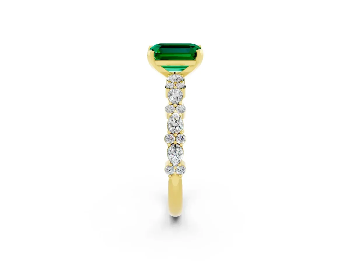 Emerald Cut Emerald Side Stone Solitaire Ring with Round and Four-Prong Setting Yellow gold