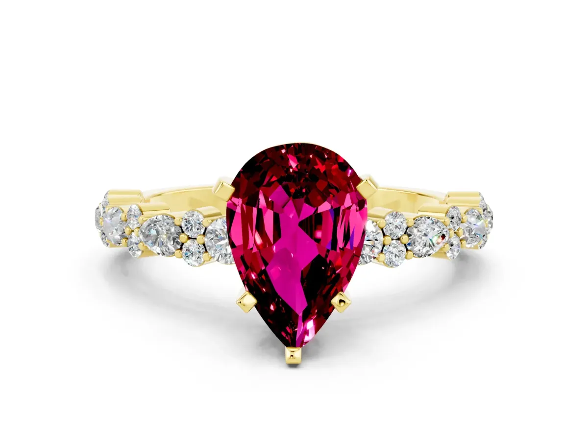 Pear Cut Garnet Side Stone Solitaire Ring with Round and Four-Prong Setting Yellow gold
