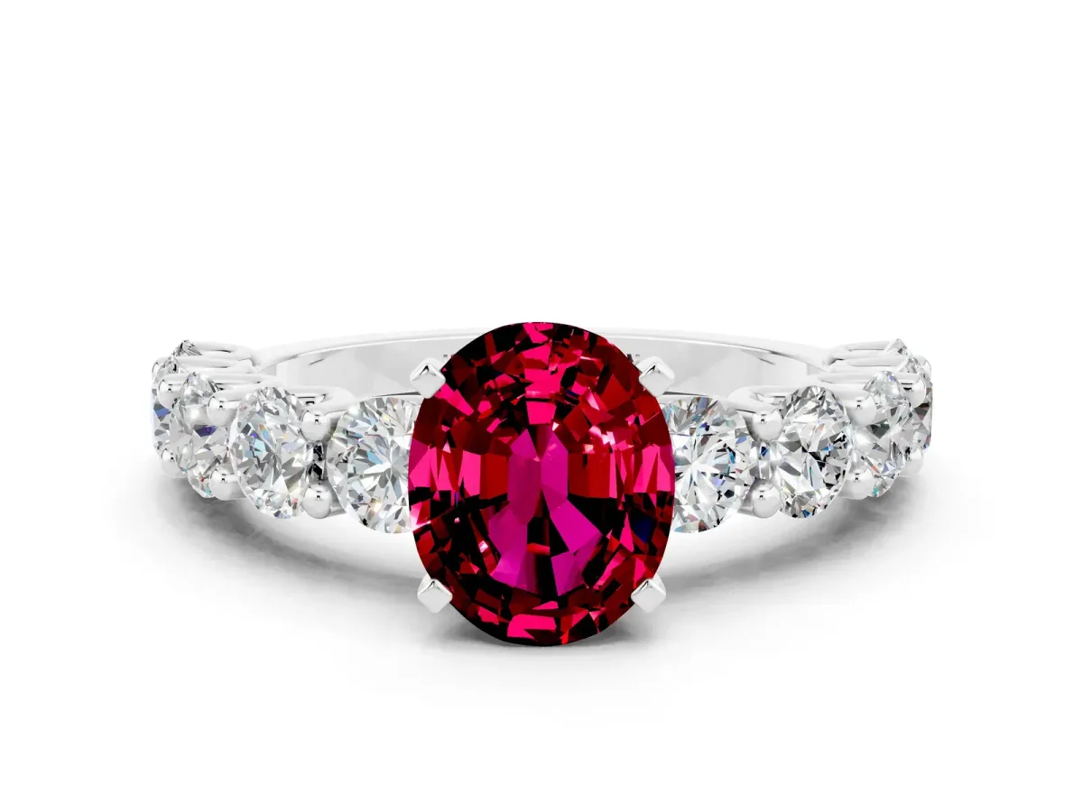 Oval Cut Garnet Prong Setting with Side Stones on a Pave Band Silver