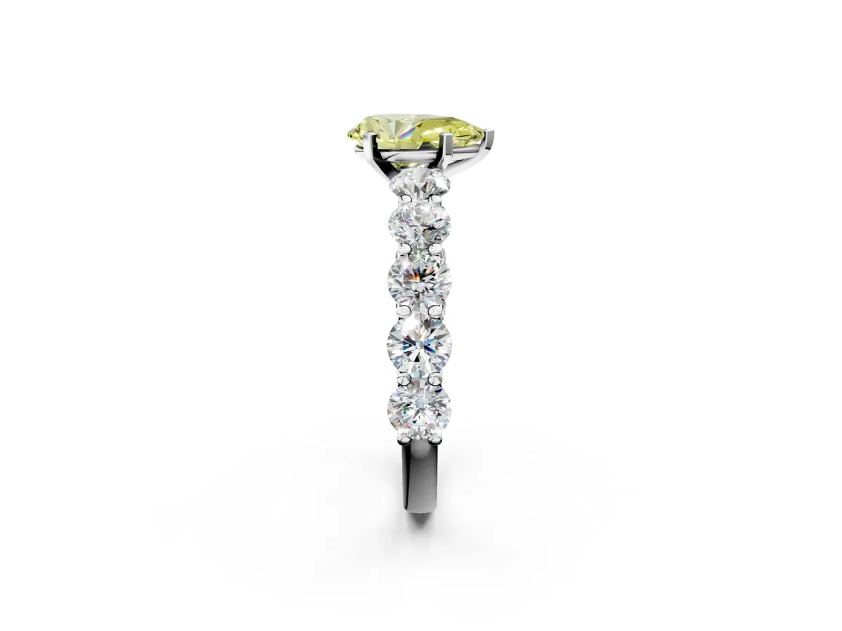Fancy Yellow Pear Cut Diamond Prong Setting with Side Stones on a Pave Band Silver