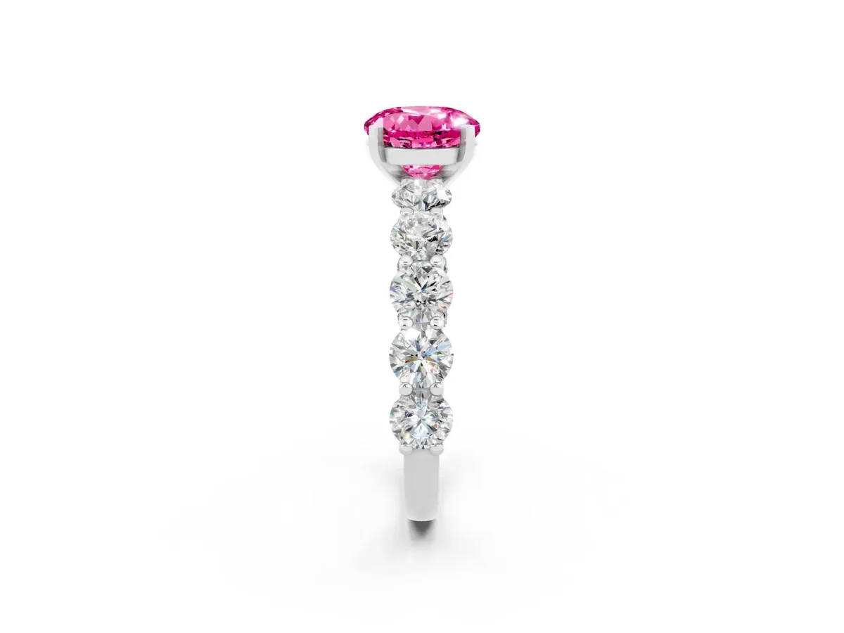 Round Cut Pink Sapphire Prong Setting with Side Stones on a Pave Band Silver