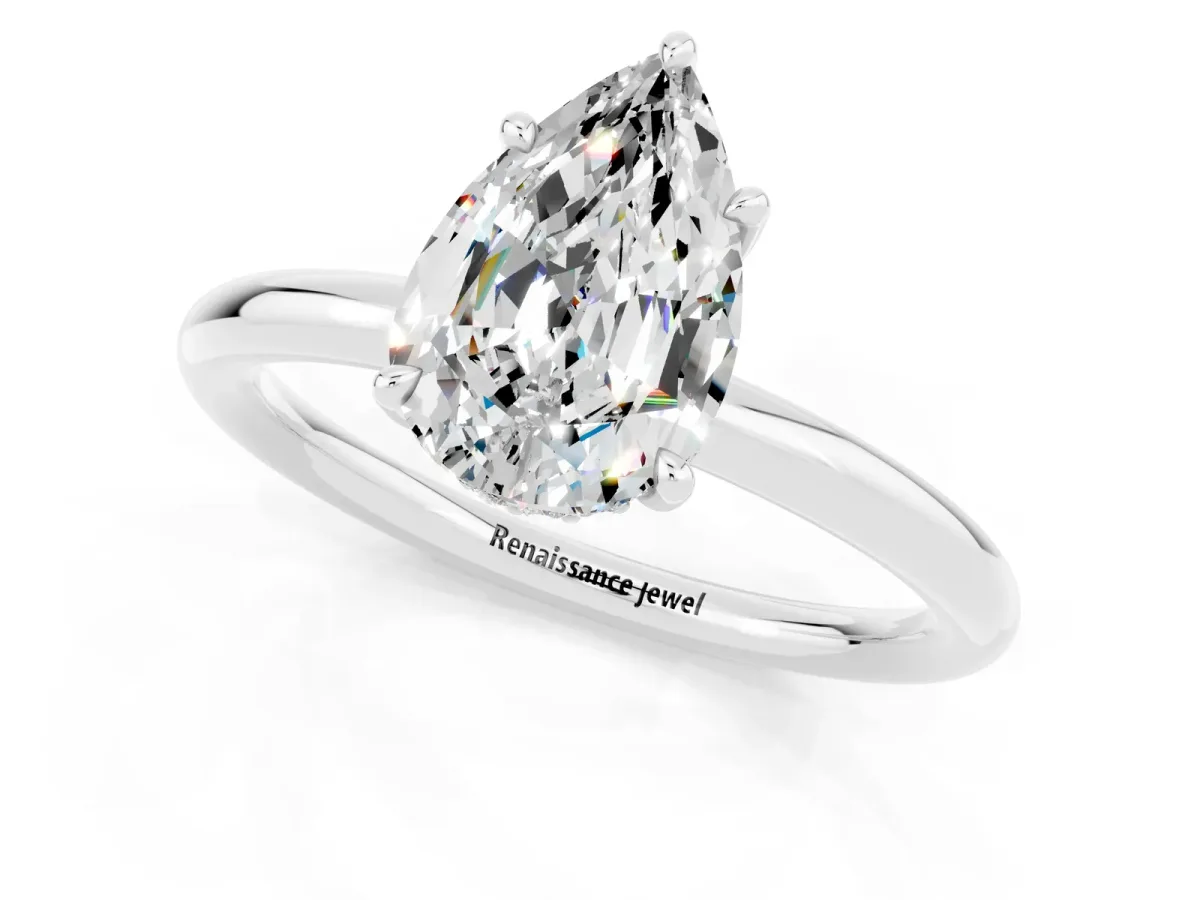 Pear Cut Moissanite Solitaire Ring with Thin Band and Four-Prong Setting Silver