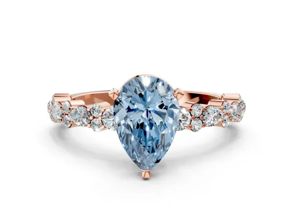 Fancy Blue Pear Cut Diamond Side Stone Solitaire Ring with Round and Four-Prong Setting Rose gold