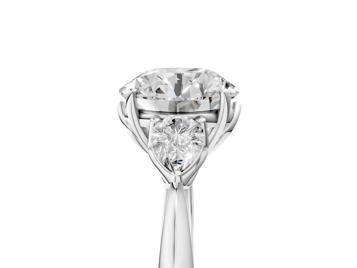 Three-Stone Round Cut Diamond Ring with Pear Side Stones in Four-Prong Setting Platinum