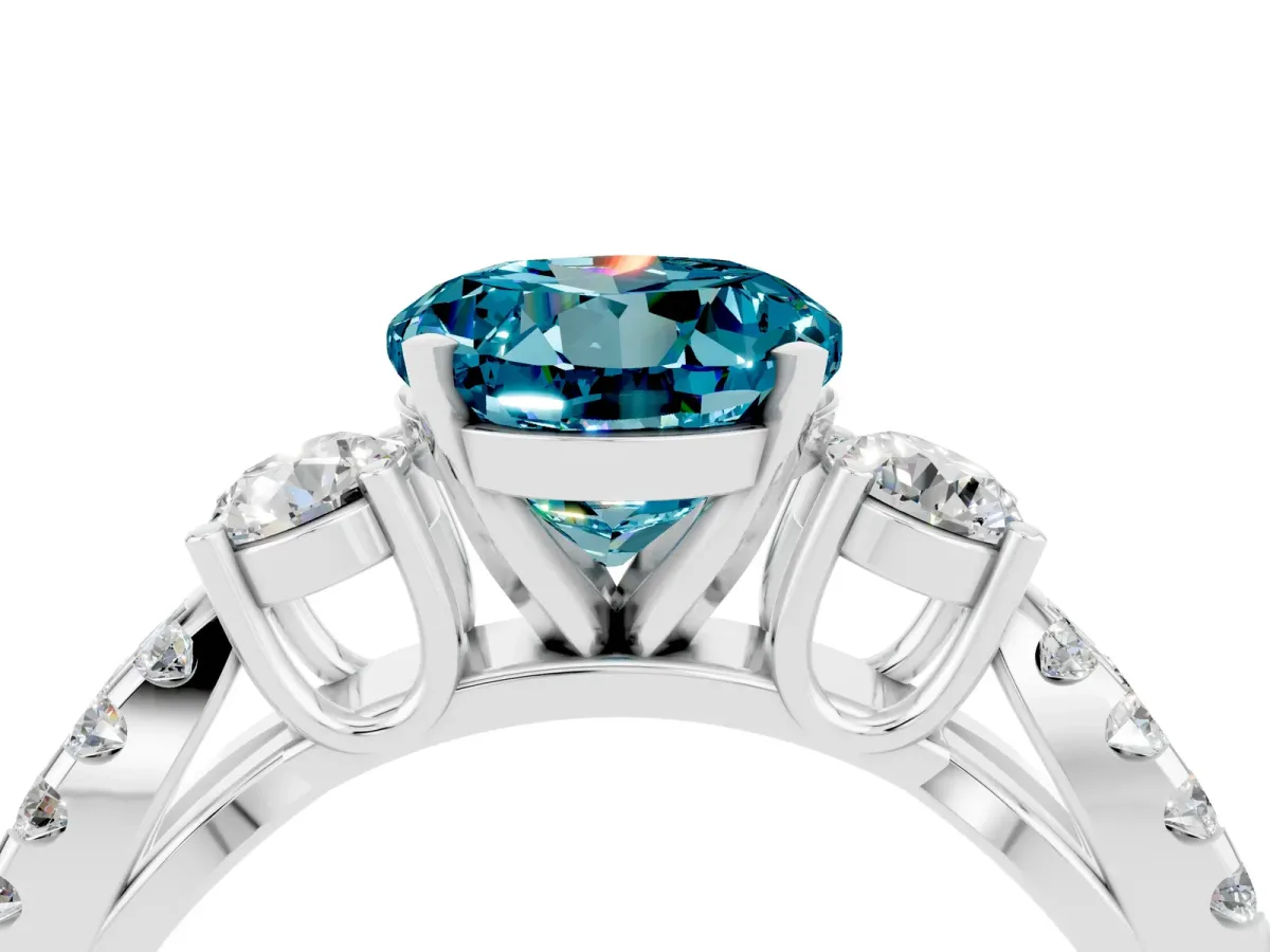 Round Cut Blue Topaz Three-Stone Ring with Pavé Split Shank and Four-Prong Setting Silver
