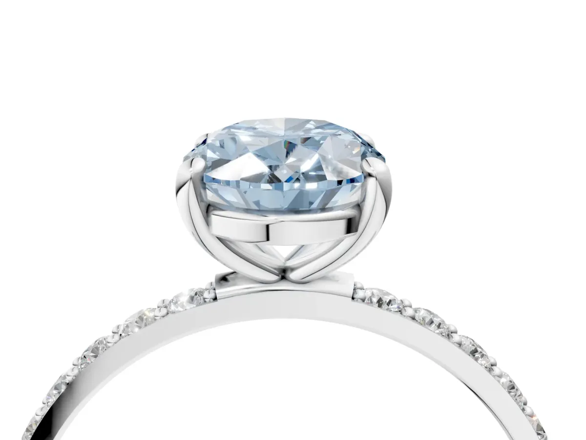 Fancy Blue Oval Cut Diamond Solitaire Ring with Round Pavé Band and Prong Setting Silver