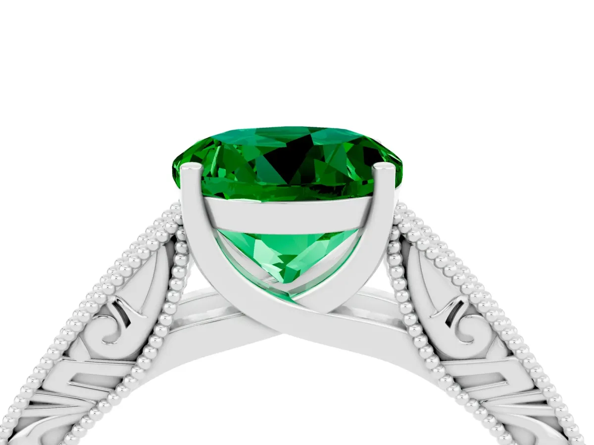 Round Cut Emerald Solitaire Ring with Engraved Band and Four-Prong Setting White gold