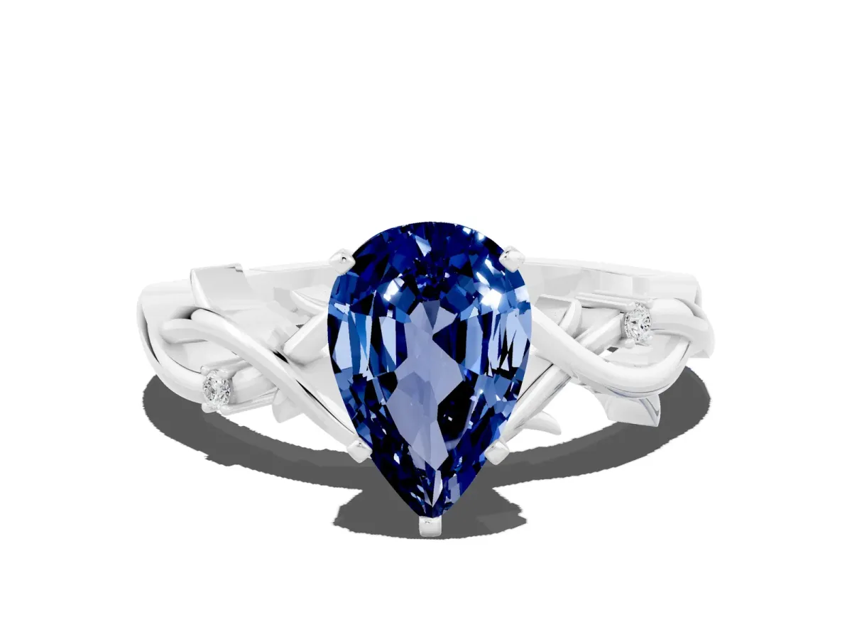 Pear Cut Blue Sapphire Solitaire Ring with Twisted Band and Prong Setting White gold