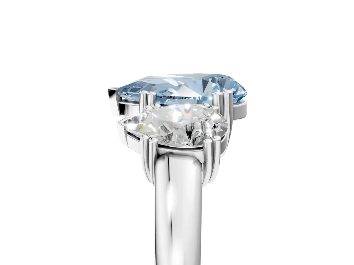 Fancy Blue Three-Stone Pear Cut Cut Diamond Ring with Channel Set Band and Four-Prong Setting Silver