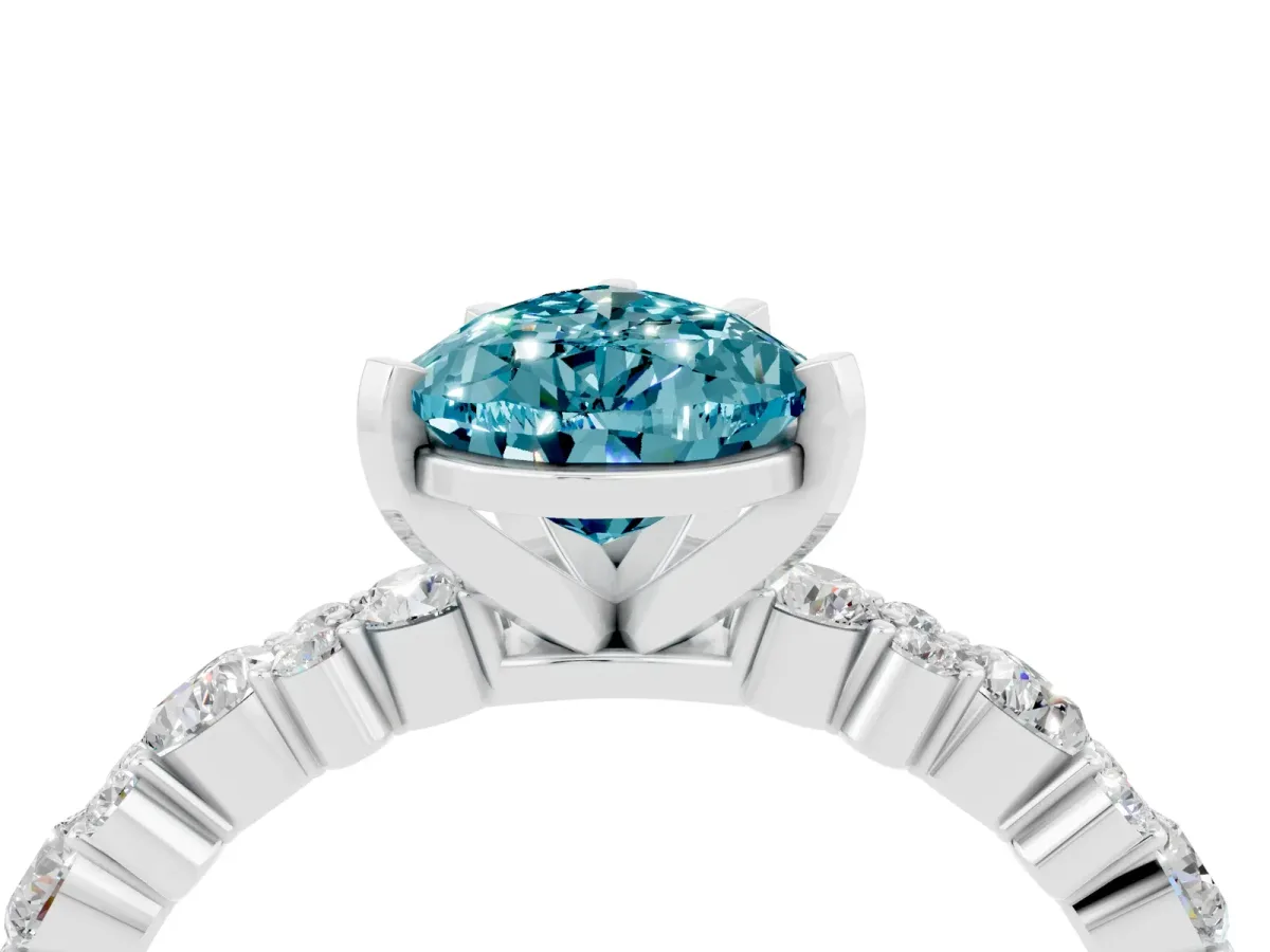 Pear Cut Blue Topaz Side Stone Solitaire Ring with Round and Four-Prong Setting Silver