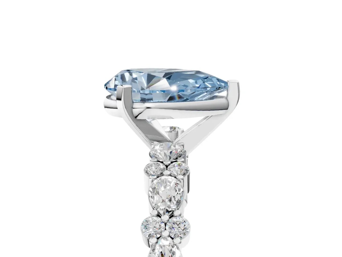 Fancy Blue Pear Cut Diamond Side Stone Solitaire Ring with Round and Four-Prong Setting Silver