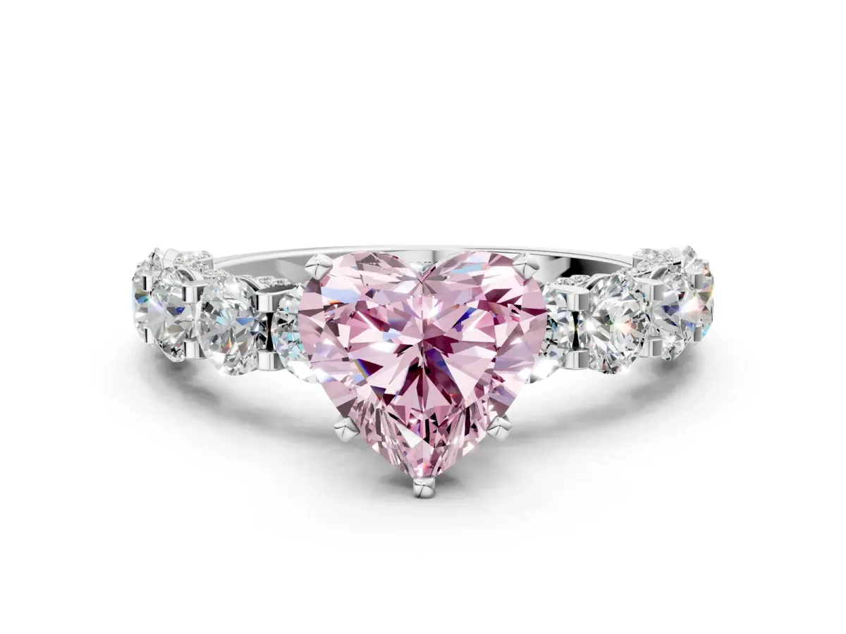Fancy Pink Heart Cut Diamond Side Stone Engagement Ring with Four-Prong Setting Platinum
