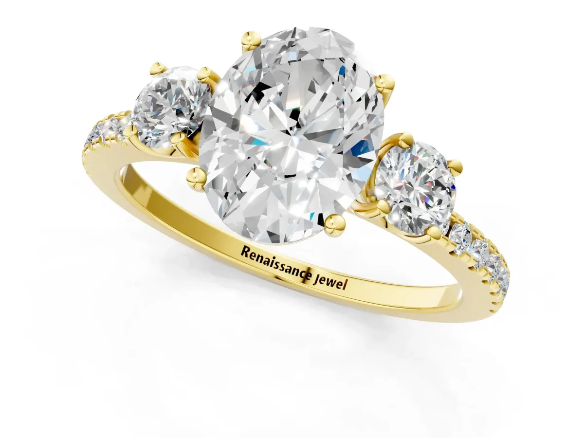 Three-Stone Oval Cut Cut Diamond Pavé Band with Prong Setting Yellow gold