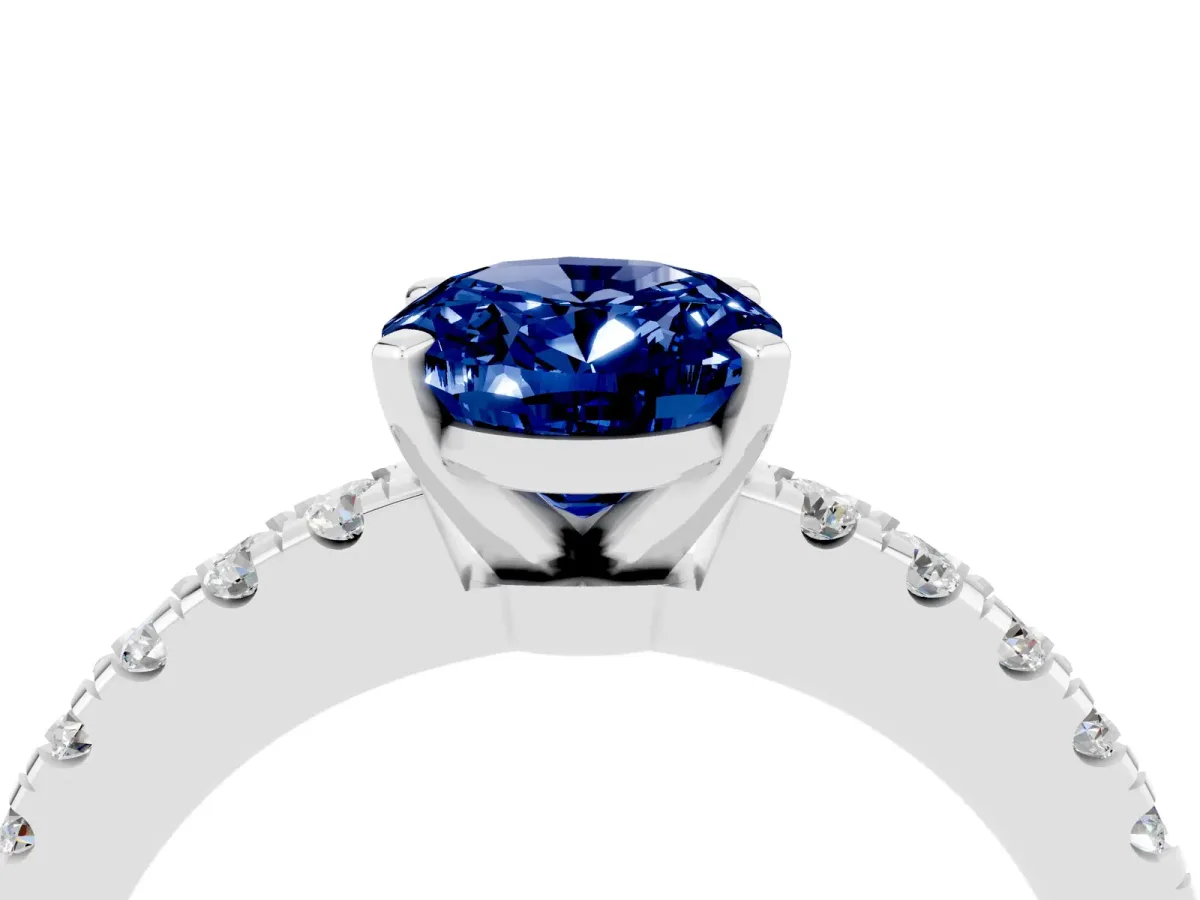 Oval Cut Solitaire Blue Sapphire with Pavé Band and Four-Prong Setting Silver