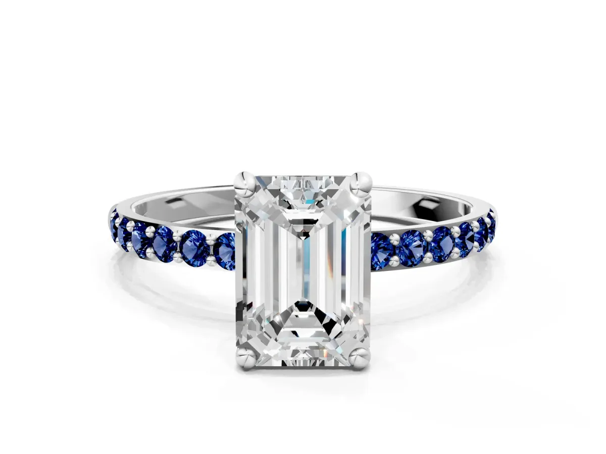 Emerald Cut Diamond Solitaire Ring with Round Blue Sapphire Pavé Band and Prong Setting Silver
