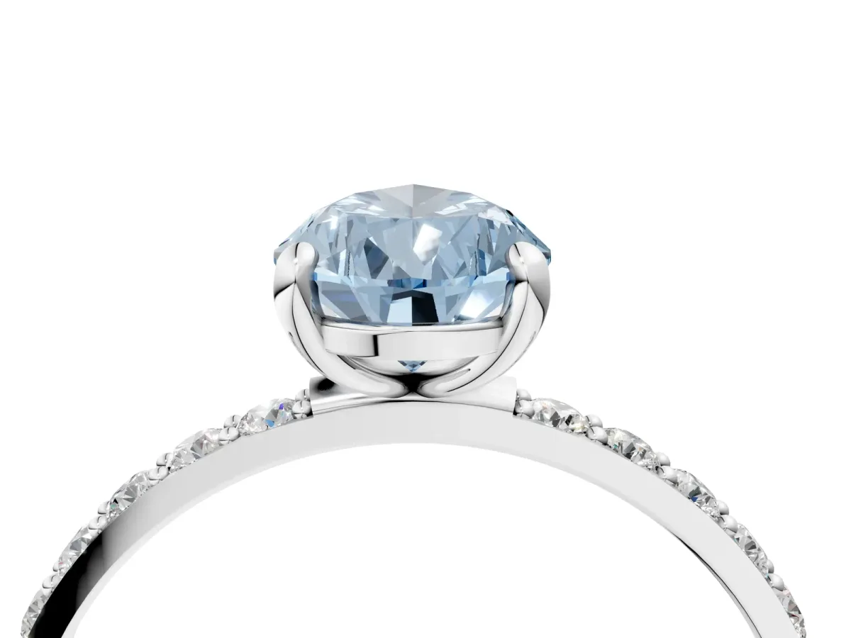 Fancy Blue Pear Cut Diamond Solitaire Ring with Round Pavé Band and Prong Setting Silver
