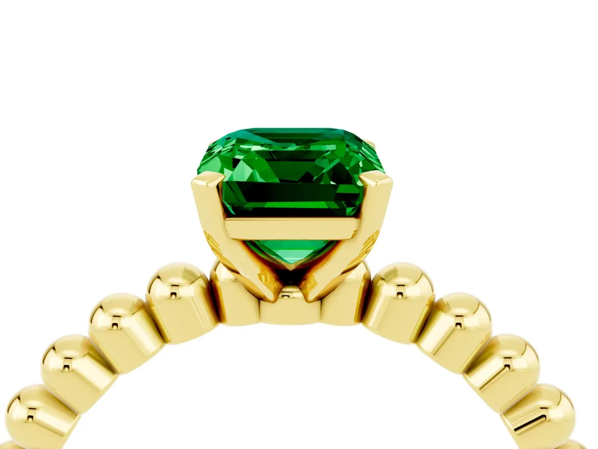 Emerald Cut Emerald Solitaire Ring with Beaded Band and Prong Setting Yellow gold