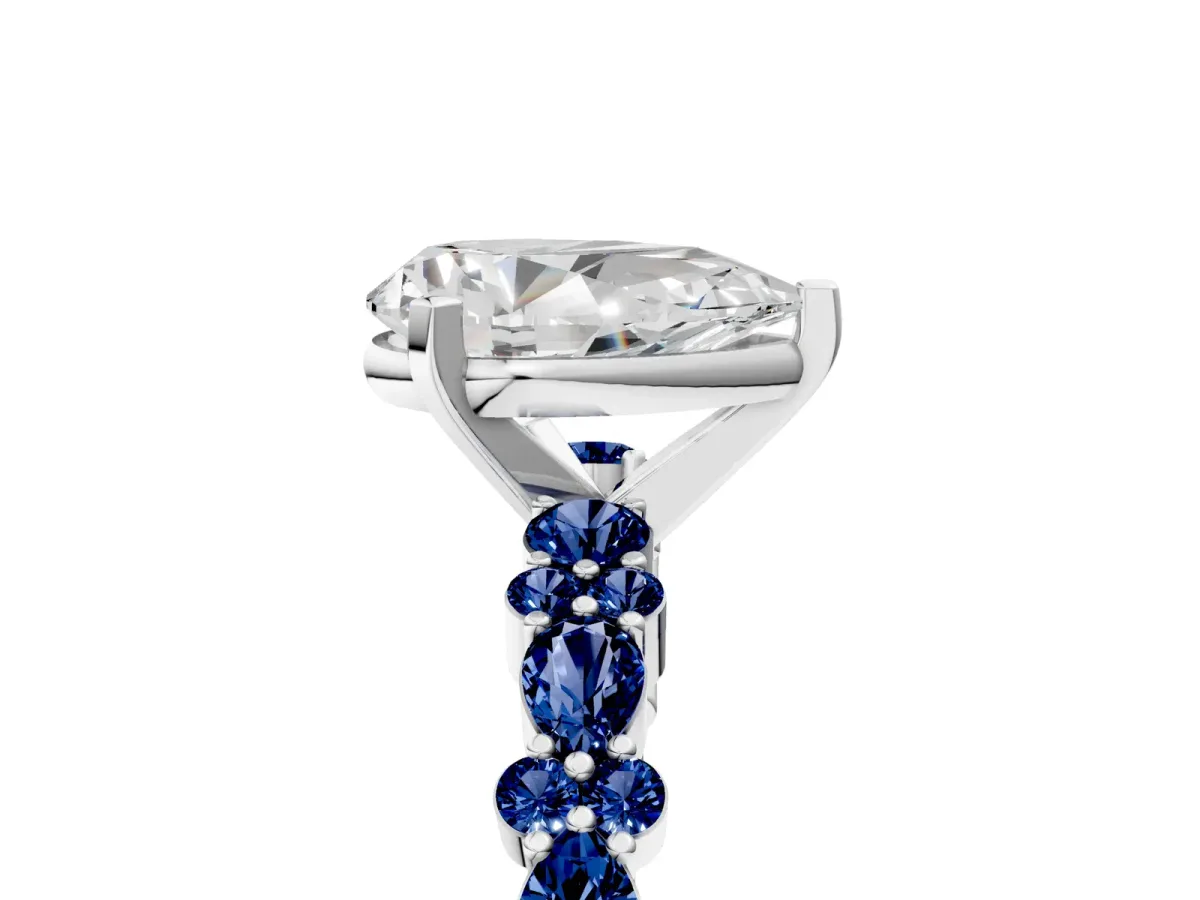 Pear Cut Diamond Side Stone Solitaire Ring with Round Blue Sapphire and Four-Prong Setting Silver