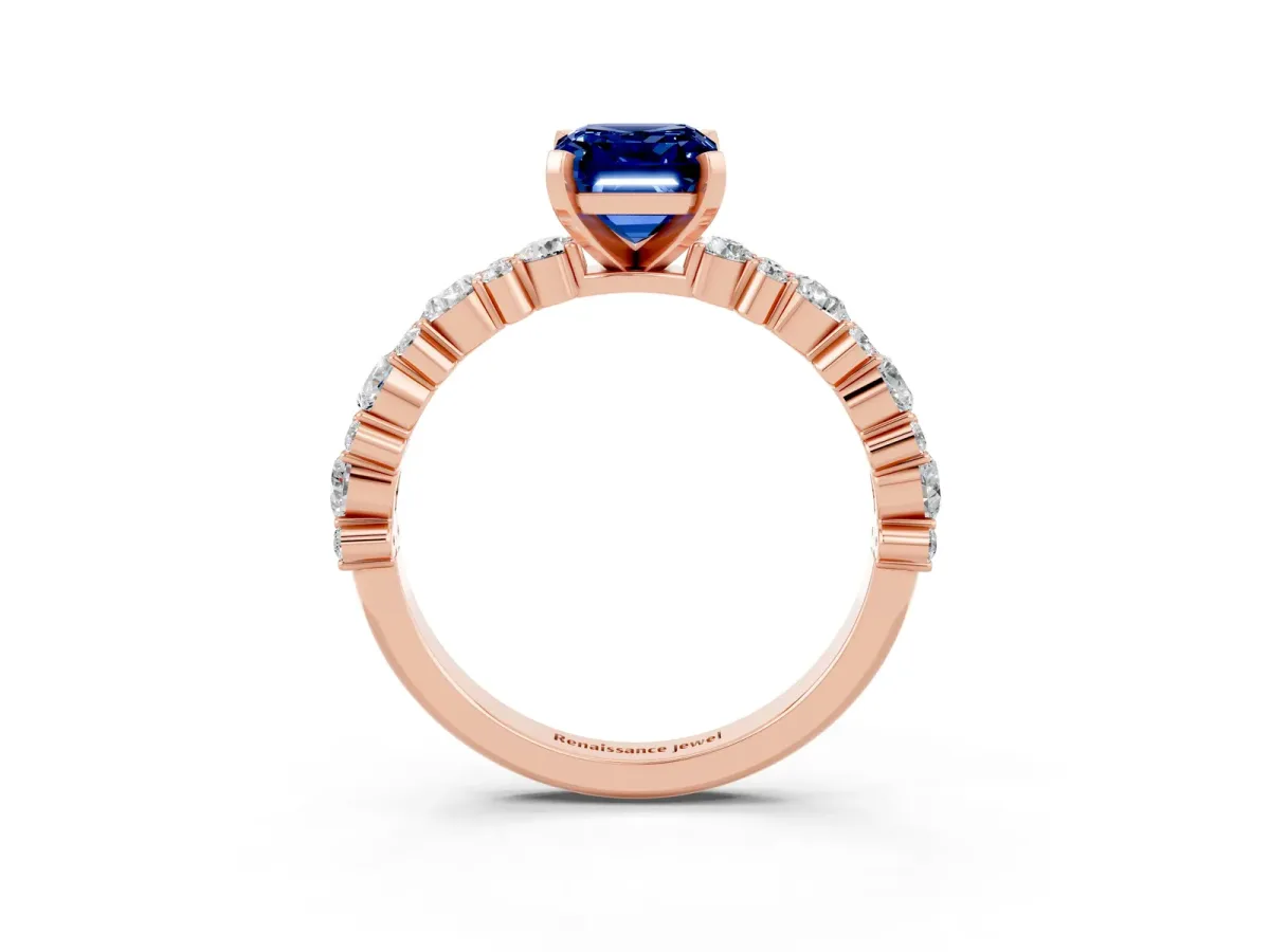 Emerald Cut Blue Sapphire Side Stone Solitaire Ring with Round and Four-Prong Setting Rose gold