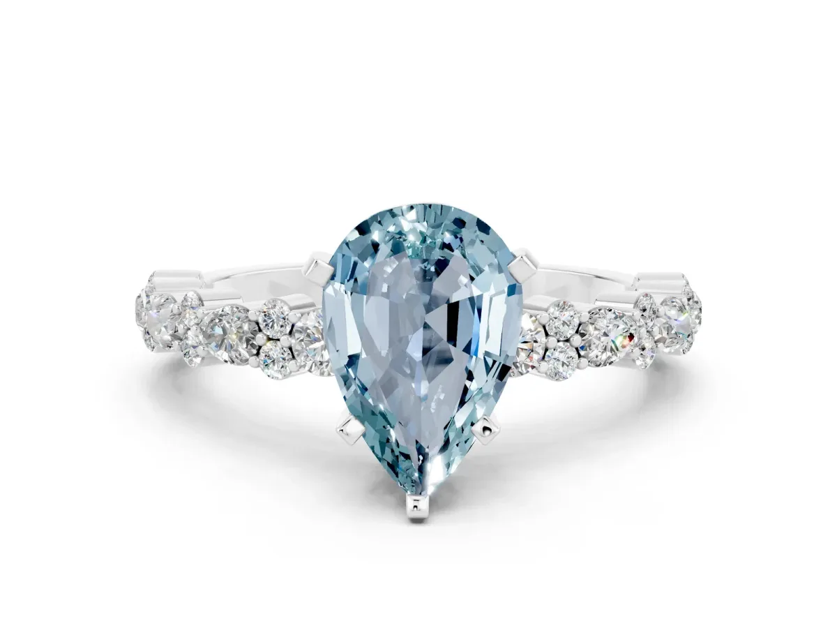 Pear Cut Aquamarine Side Stone Solitaire Ring with Round and Four-Prong Setting Silver