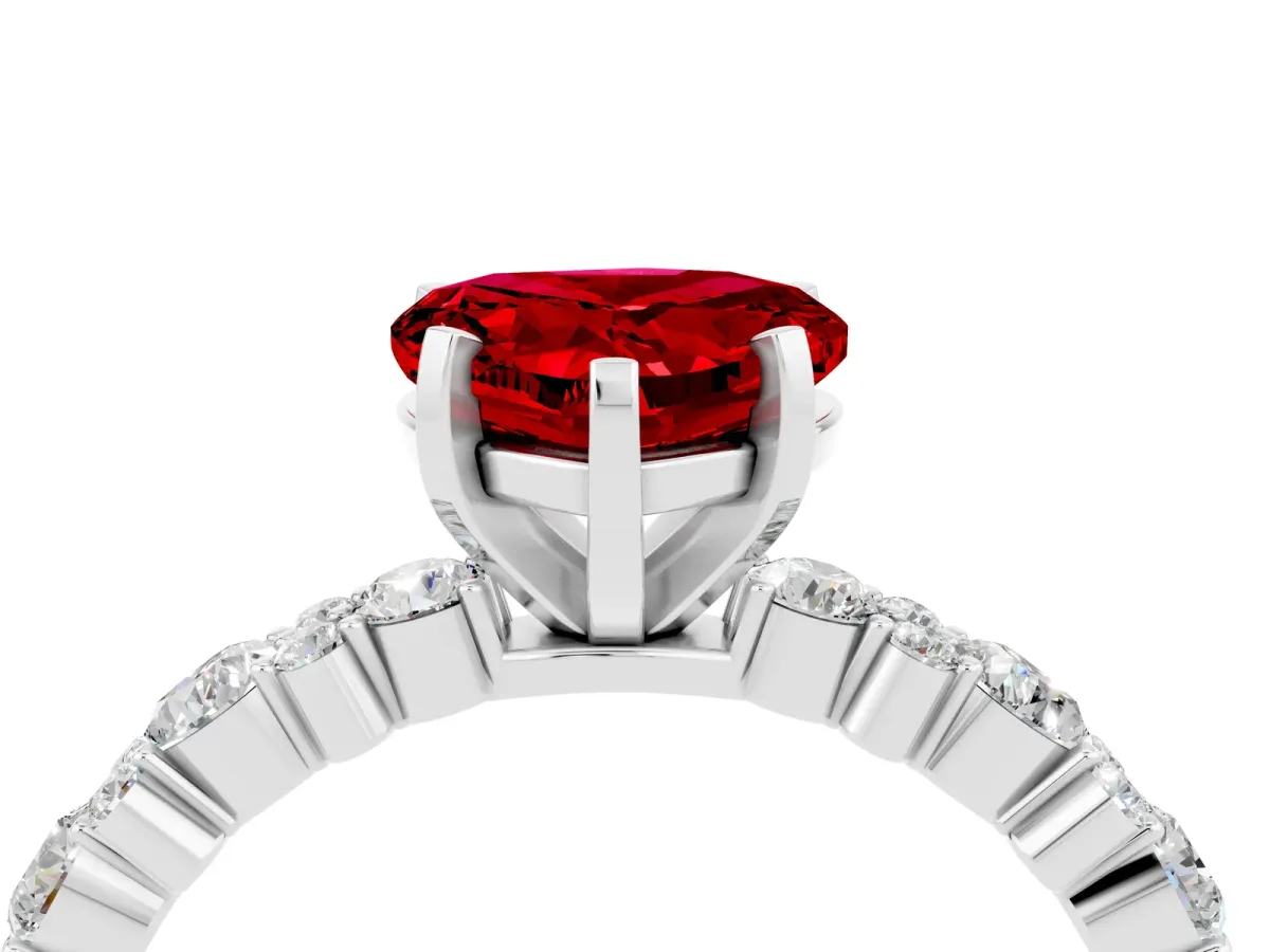 Heart Cut Ruby Side Stone Solitaire Ring with Round and Four-Prong Setting Silver