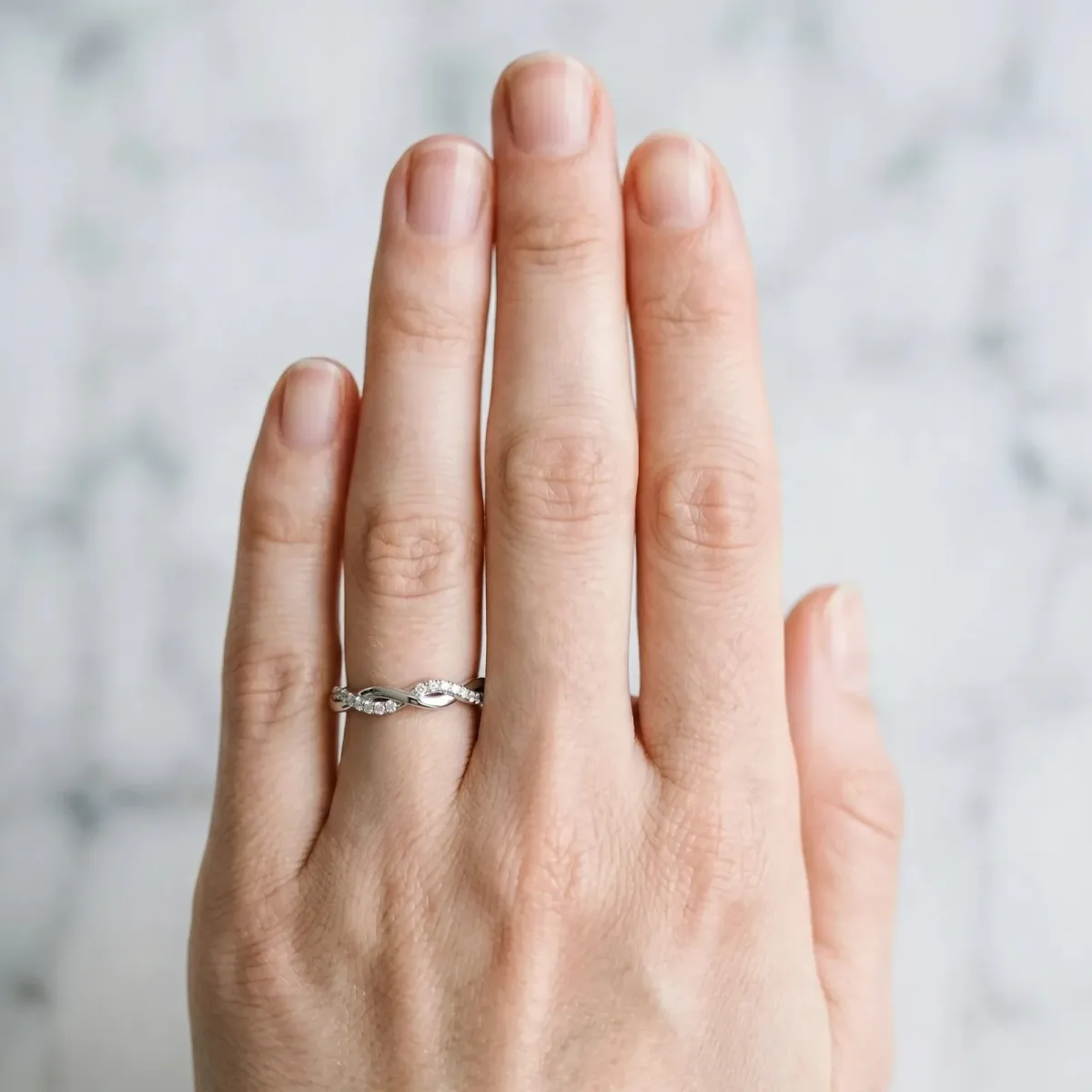 Twisted Pave Round Diamond Infinity Band with Channel Setting Platinum