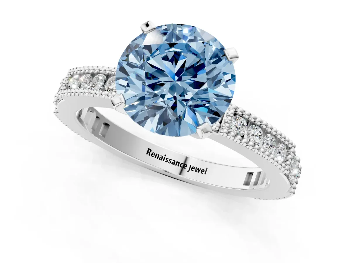 Fancy Blue Round Cut Solitaire with Pavé Band and Four-Prong Setting Silver