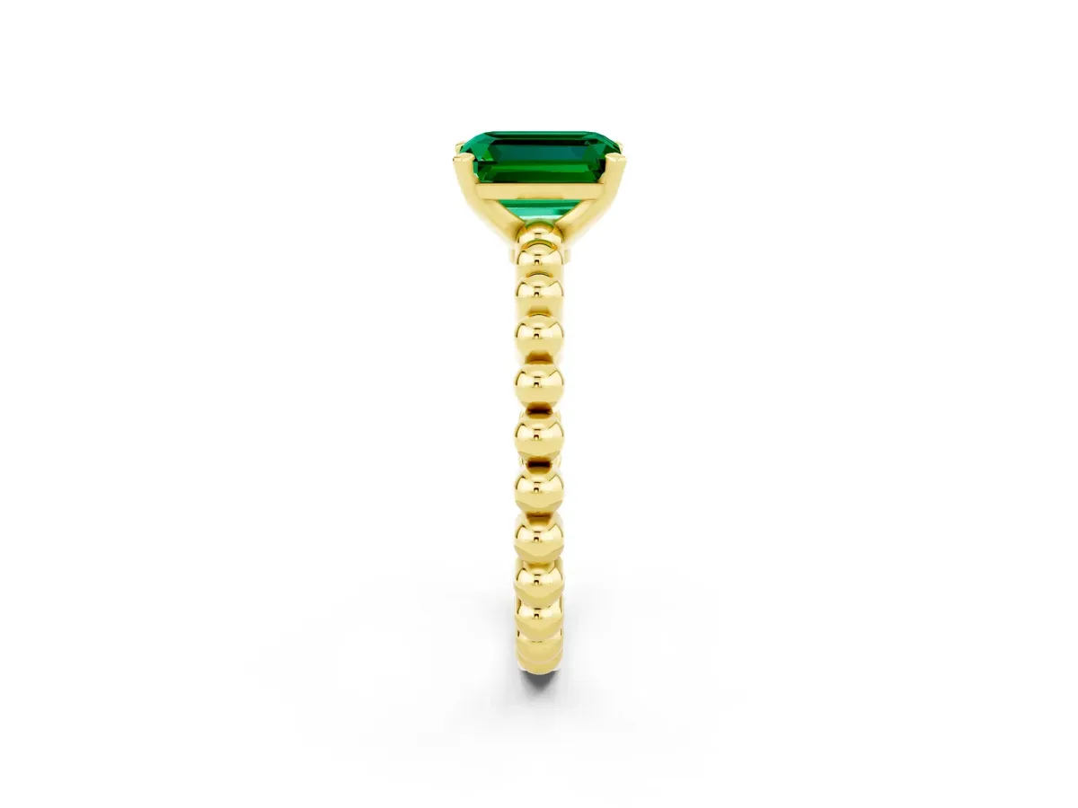 Emerald Cut Emerald Solitaire Ring with Beaded Band and Prong Setting Yellow gold