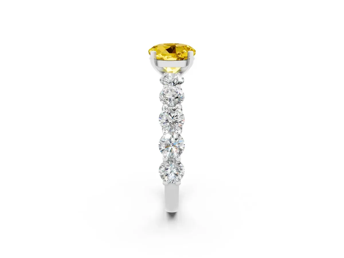 Round Cut Yellow Sapphire Prong Setting with Side Stones on a Pave Band Silver