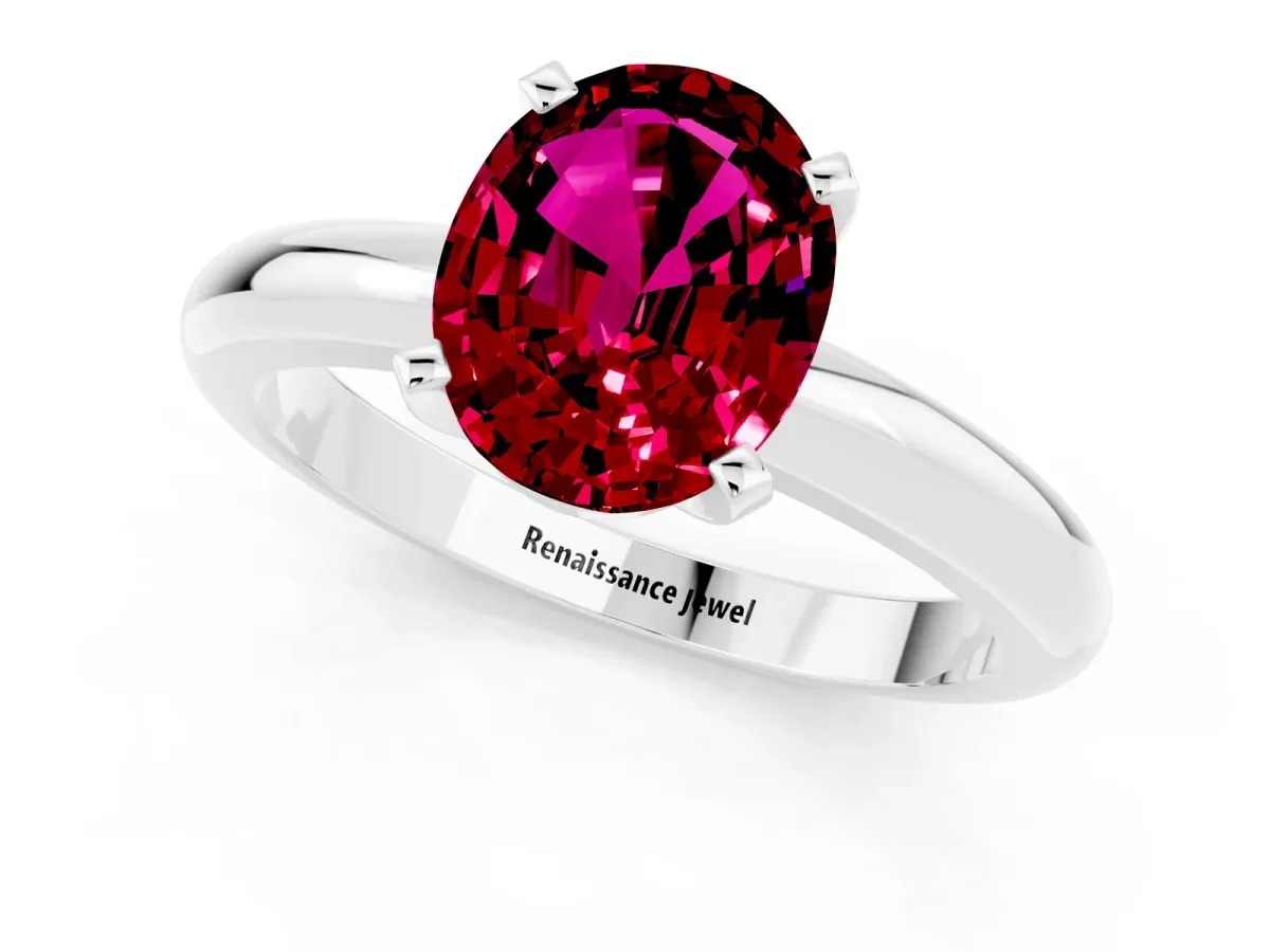 Oval Cut Garnet Solitaire Engagement Ring with Round Band and Four-Prong Setting Silver