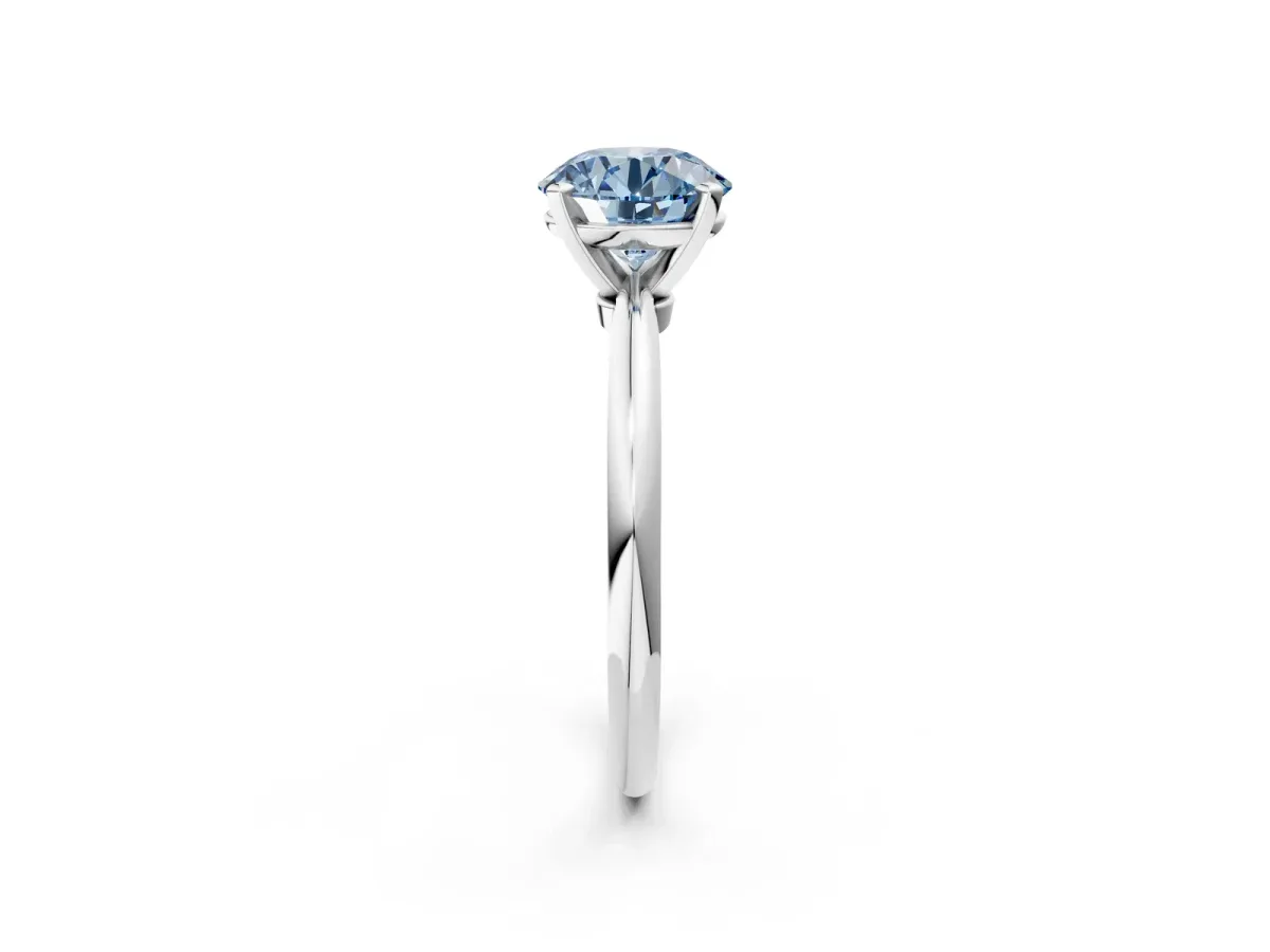 Fancy Blue Round Cut Diamond Solitaire Ring with Six-Prong Setting and Classic Band Silver