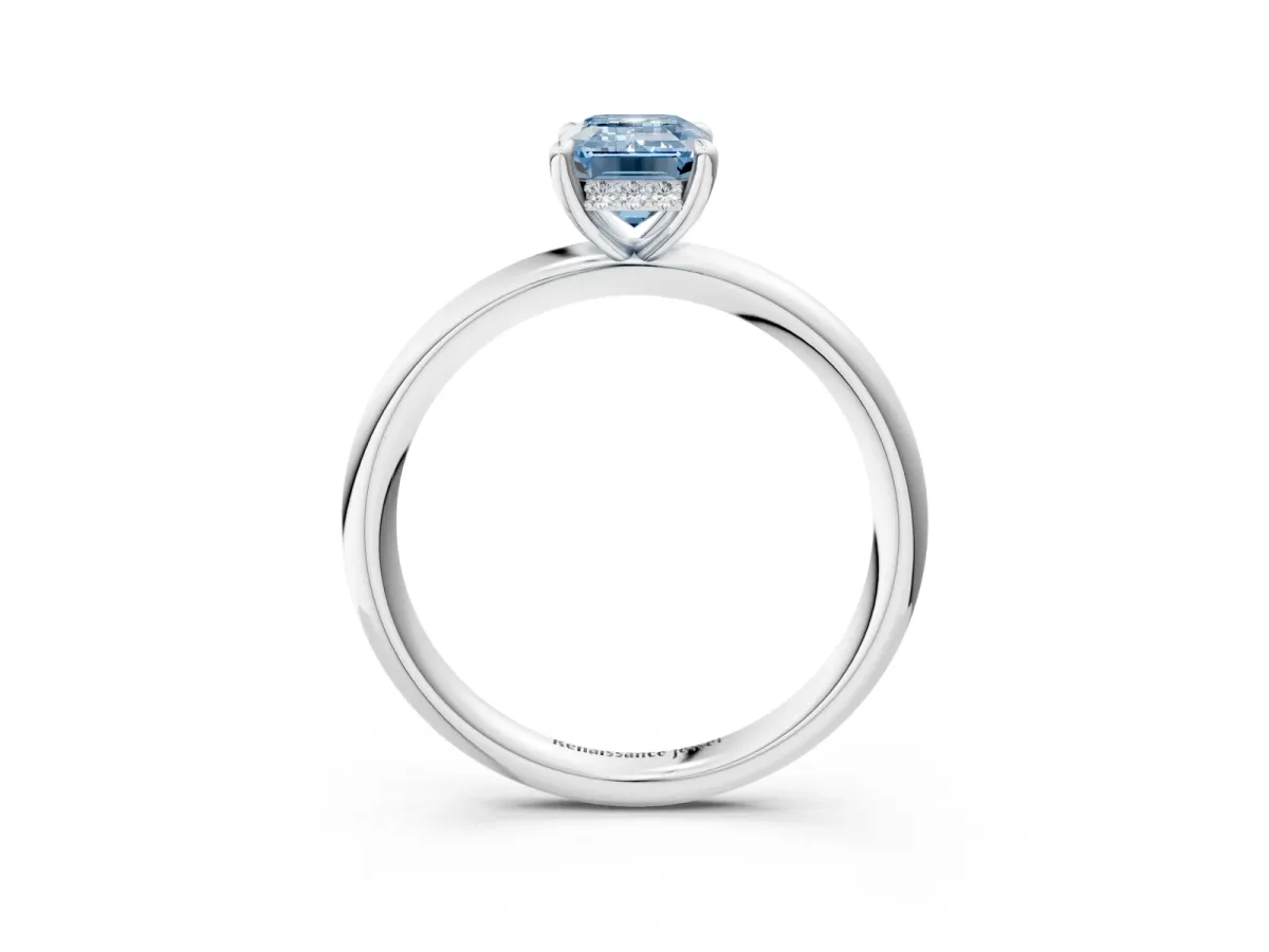 Fancy Blue Emerald Cut Diamond Solitaire Ring with Thin Band and Four-Prong Setting Platinum