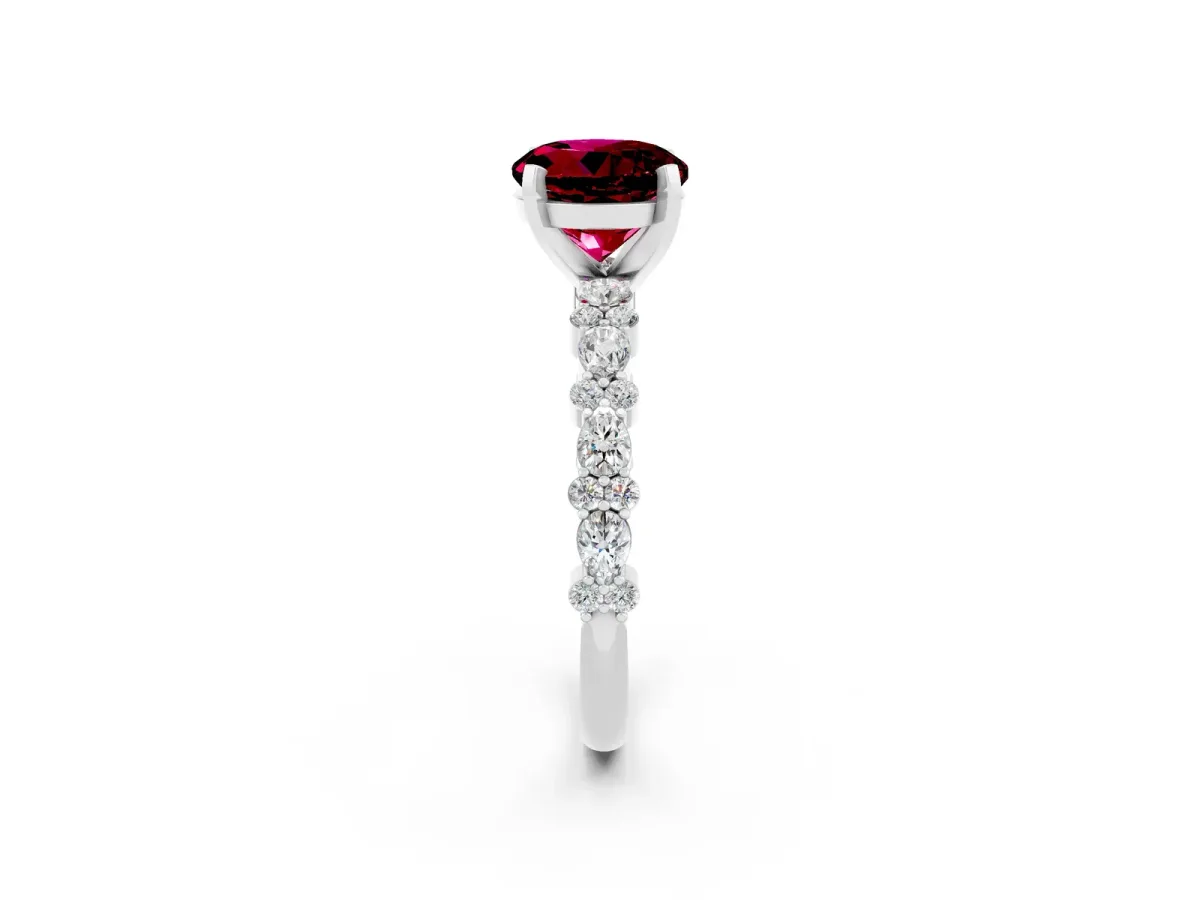 Round Cut Garnet Side Stone Solitaire Ring with Round and Four-Prong Setting Platinum
