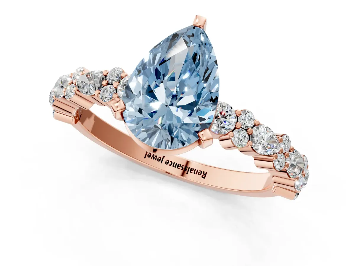 Fancy Blue Pear Cut Diamond Side Stone Solitaire Ring with Round and Four-Prong Setting Rose gold