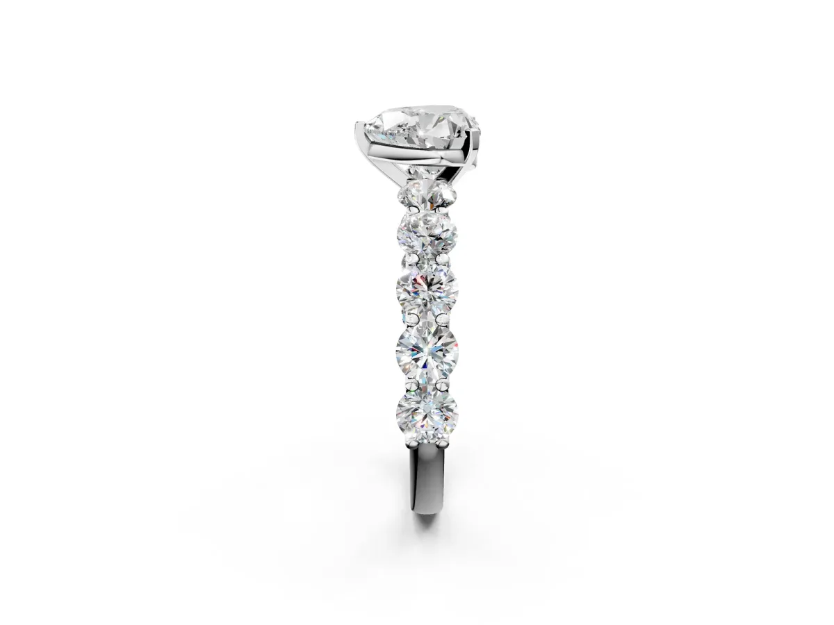 Heart Cut Diamond Prong Setting with Side Stones on a Pave Band Silver