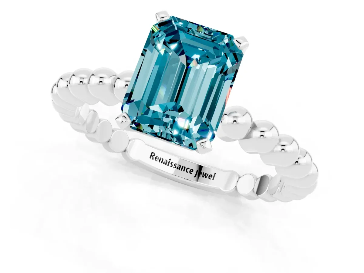 Emerald Cut Blue Topaz Solitaire Ring with Beaded Band and Prong Setting Silver