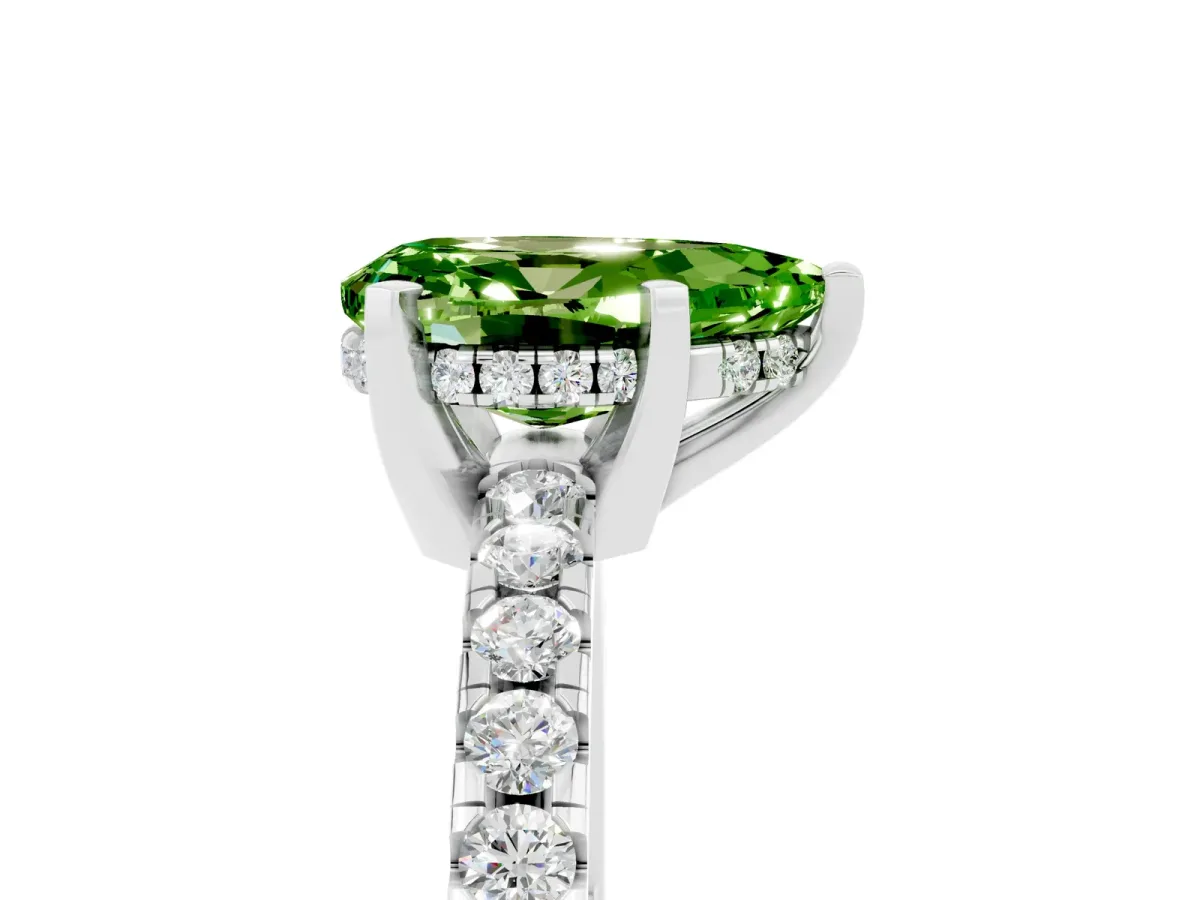 Pear Cut Peridot Solitaire Ring with Round Pavé Band and Four-Prong Setting Silver