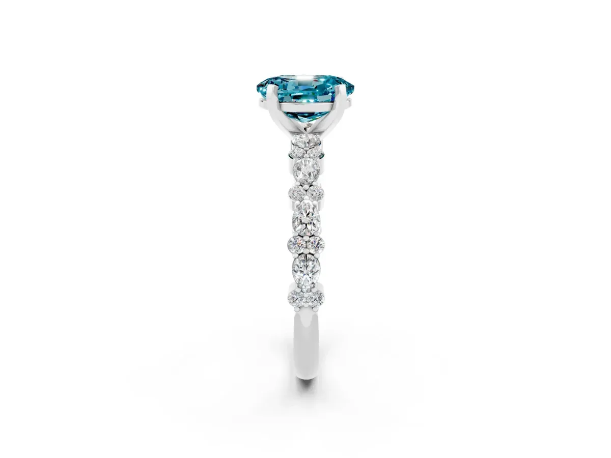 Oval Cut Blue Topaz Side Stone Solitaire Ring with Round and Four-Prong Setting Silver
