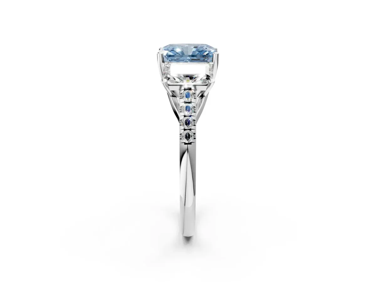 Fancy Blue Three-Stone Radiant Cut Diamond Ring with Round Pavé Band and Prong Setting Silver