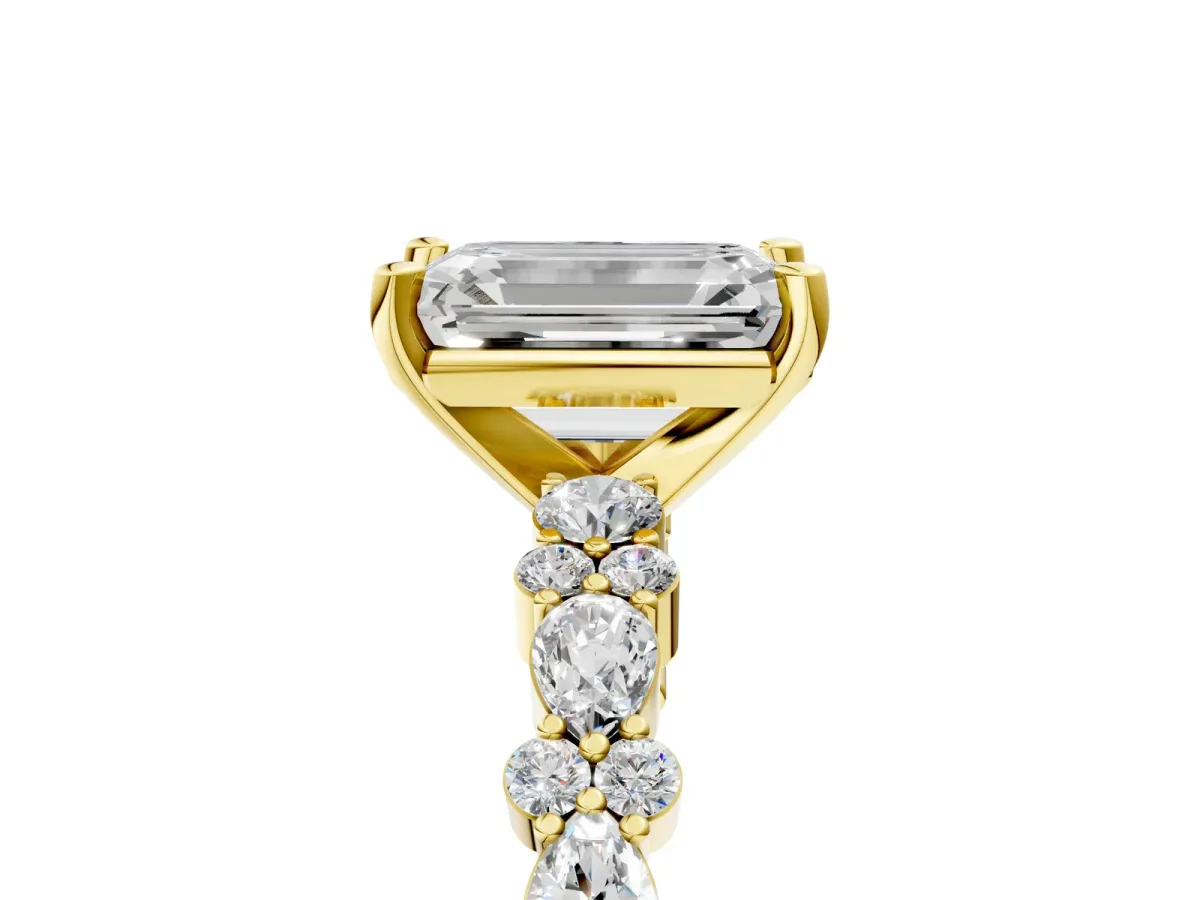 Emerald Cut Diamond Side Stone Solitaire Ring with Round and Four-Prong Setting Yellow gold