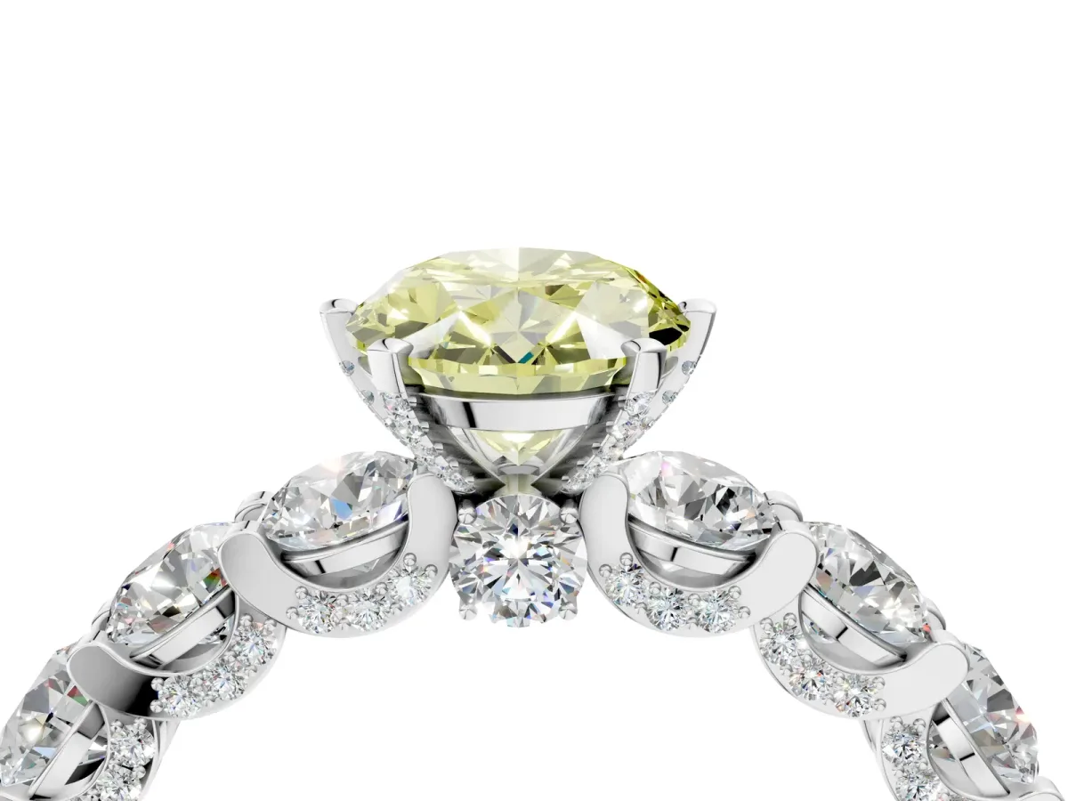 Fancy Yellow Oval Cut Diamond Side Stone Engagement Ring with Four-Prong Setting White gold