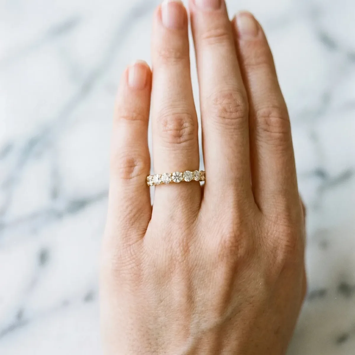 Round Cut Diamond Eternity Band with Shared Prong Setting Yellow gold
