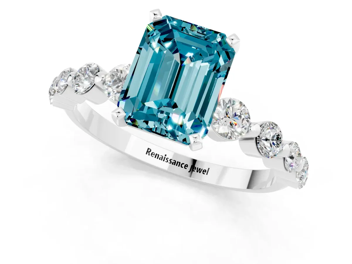 Emerald Cut Solitaire Blue Topaz Ring with Pave Band and Four-Prong Setting Platinum