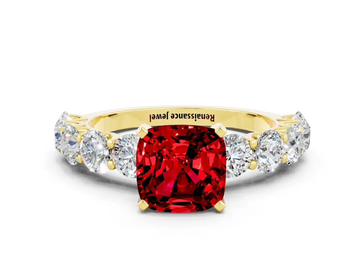 Cushion Cut Ruby Prong Setting with Side Stones on a Pave Band Yellow gold