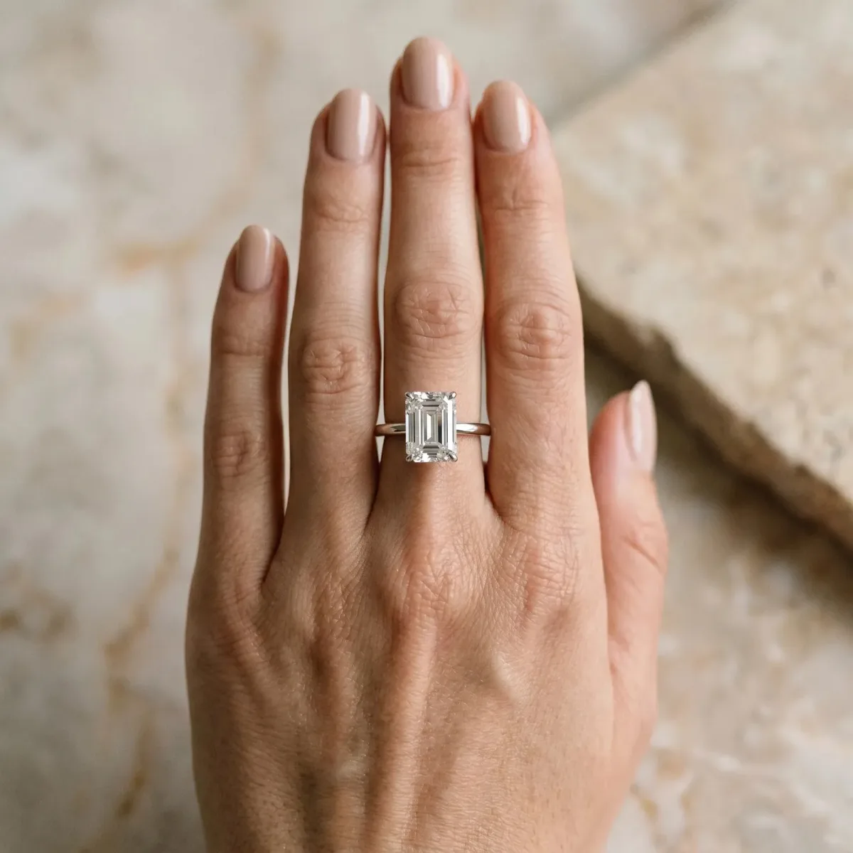 Emerald Cut Diamond Solitaire Ring with Thin Band and Four-Prong Setting White gold